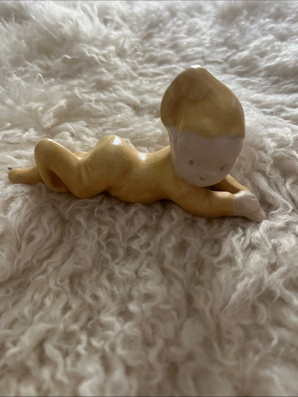 Glossy Yellow Ceramic Baby Figurine Lying Pose